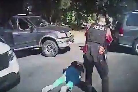 Keith Lamont Scott (L) lying on the ground after being shot (AFP/CHARLOTTE-MECKLENBURG POLICE DEPT)