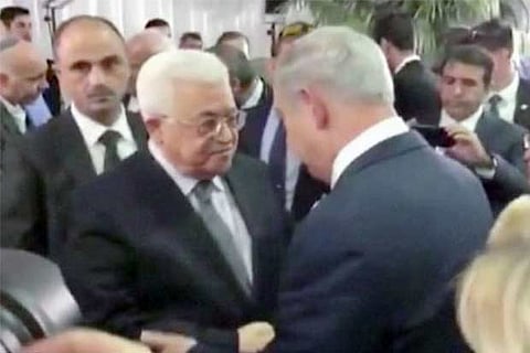 Palestine Prez, Israel PM shake hands at funeral