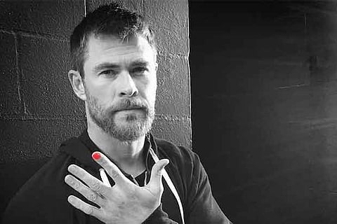 Actor Chris Hemsworth poses as part of the campaign