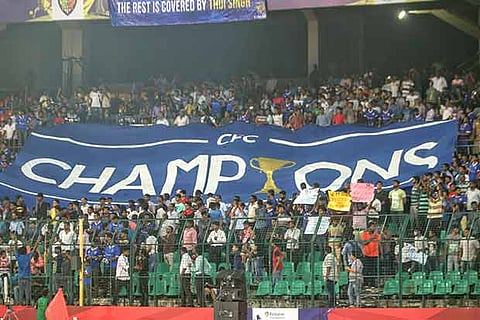Fans in B-Stand show a ?Champions? banner during the ISL match against Delhi Dynamos