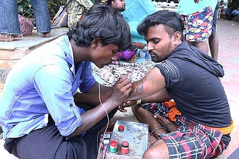 A youngster getting inked on the Marina Beach (Photo: Manivasagan N)