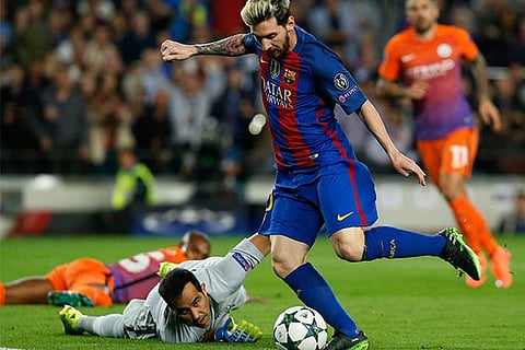 Messi treble as Guardiola suffers on Barcelona return