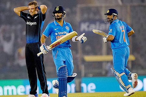 Virat Kohli (left) and MS Dhoni put the Indian chase back on track with a 151-run partnership