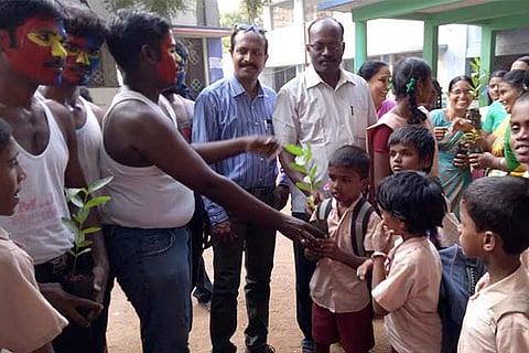 Volunteers distribute saplings after street play at a Corporation High School in Tiruchy