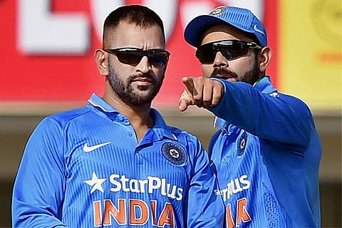 India captain M S Dhoni busy with Virat Kohli