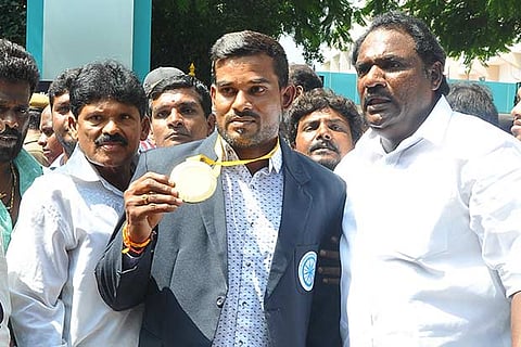 Cheralathan displays the gold medal he won at the Kabaddi World Cup