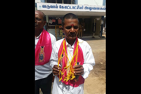 Boozers Welfare Association candidate MS Arumugam on his way to file his papers