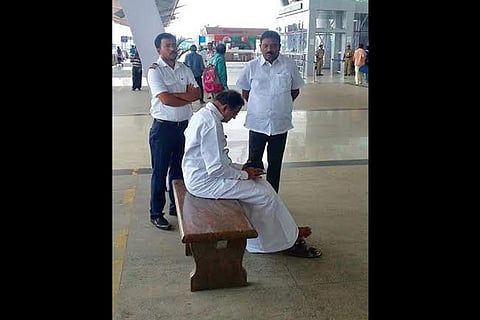 P Chidambaram waits at a bench outside the Chennai airport