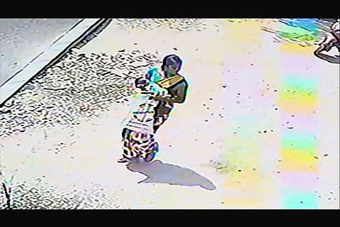 A grab form CCTV camera shows the woman taking away the new-born baby from Salem GH