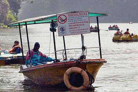 A boat at the Ooty lake, one of the 8 spots, with No Selfie board