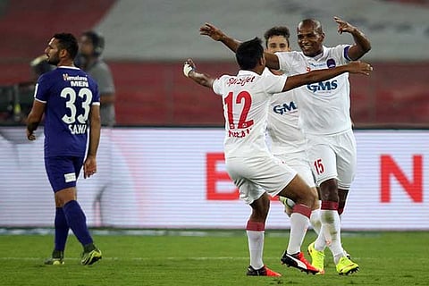 Delhi Dynamos? Florent Malouda (right) celebrates a goal against Chennaiyin FC