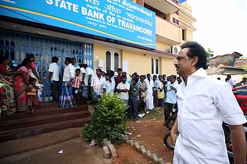 DMK treasurer MK Stalin visiting a bank in Madurai during his election campaign