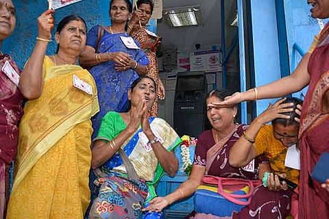 AIDWA members garlanded an ATM near the Collectorate in Coimbatore and staged a demonstration