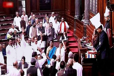 AIADMK members gathering at the well of Rajya Sabha