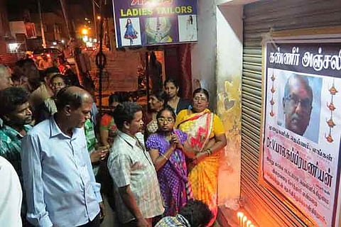 Patients of Dr Balasubramaniam lit candles in front of his clinic and paid respects to his soul