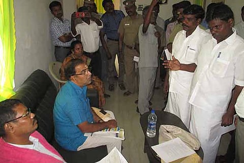 Members of the NCSC team interacting with the family of Parthiban