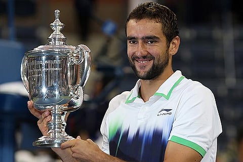 Croatian Marin Cilic with the only Grand Slam trophy he has won ? US Open in 2014