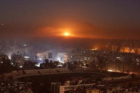 Smoke and flames rise after air strikes on rebel-controlled besieged area of Aleppo