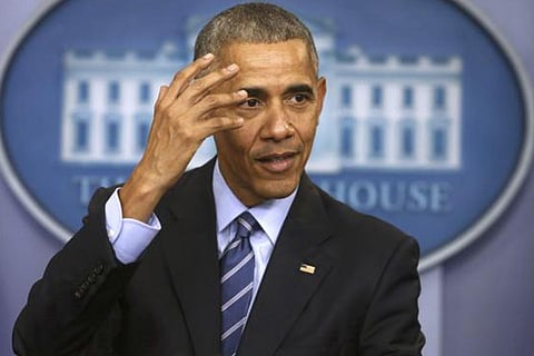 US President Barack Obama participates in his last news conference of the year at the White House