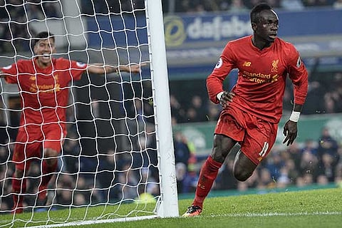 Sadio Mane (right) scores the match-winner for Liverpool