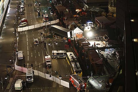 Authorites inspect a truck that had sped into a Christmas market in Berlin