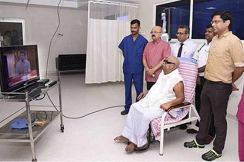 The photo released by Kauvery Hospital on December 21 shows Karunanidhi watching TV