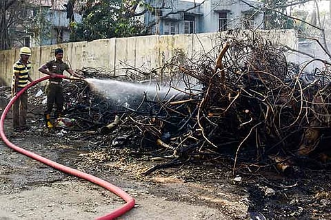Fire and rescue personnel dousing the blaze near Egmore railway station on saturday