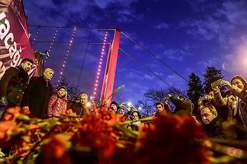 People lay flowers in front of the Reina nightclub on January 3, 2017