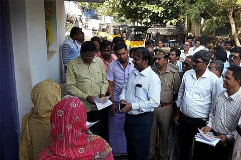 Collector M Karunakaran inspecting a house in Kadayanallur