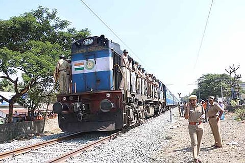 Police officers standing on the train