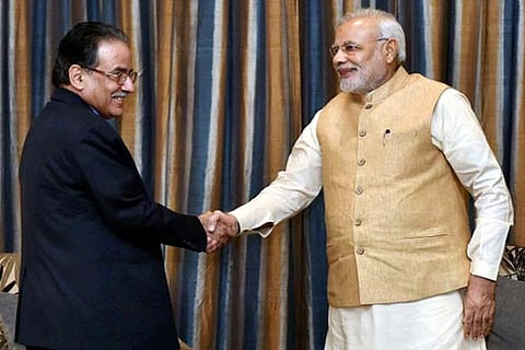 PM Narendra Modi shakes hands with his Nepali counterpart Pushpa Kamal Dahal 'Prachanda'