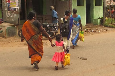 Women and children leaving Alanganallur village in Madurai district