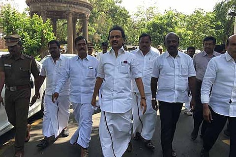 DMK MLAs, led by Opposition Leader M K Stalin, walking out of the Assembly