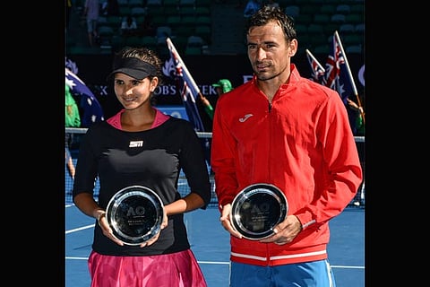 Sania Mirza (left) and her mixed doubles partner Ivan Dodig