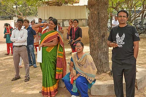 A file photo of parents anxiously waiting for their children outside an examination centre
