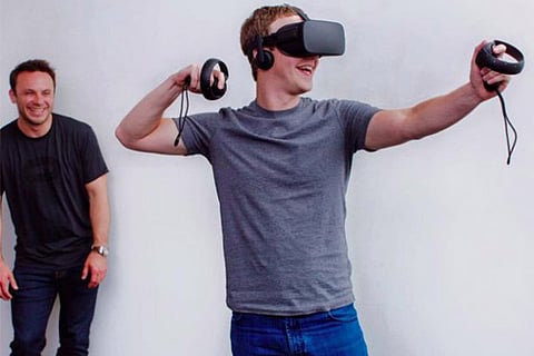 Facebook CEO Mark Zuckerberg with a VR Headset on