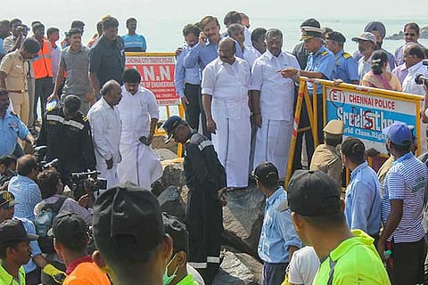 Chief Minister O Panneerselvam inspecting the cleaning operation at Ernavur