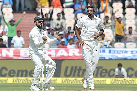 Virat Kohli and Ashwin celebrate the wicket of Shakib-al Hasan