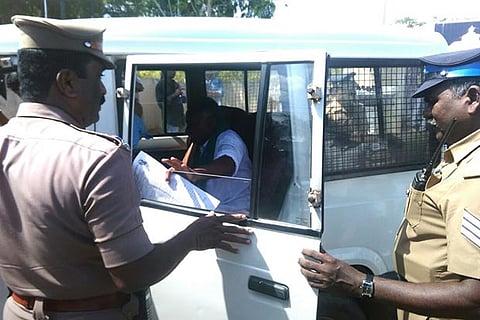 Tamilaga Vivasayigal Sangam district president M P Chinnadurai being arrested