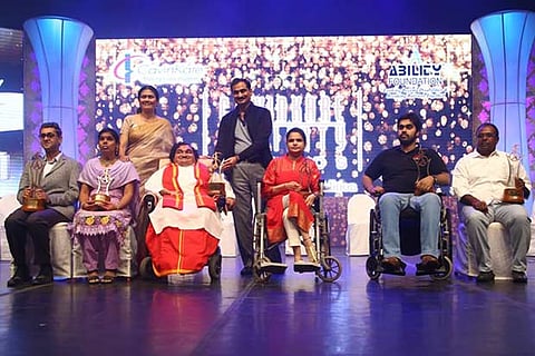 The winners pose after receiving the award for their achievements