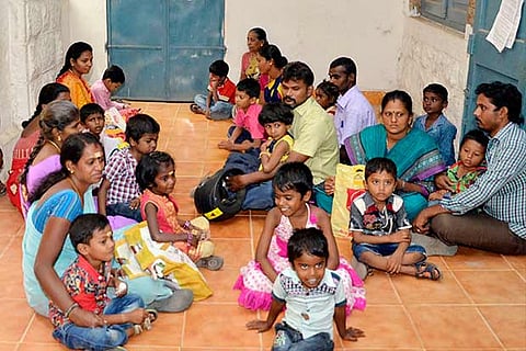 Parents, kids seen waiting outside an Aadhaar centre