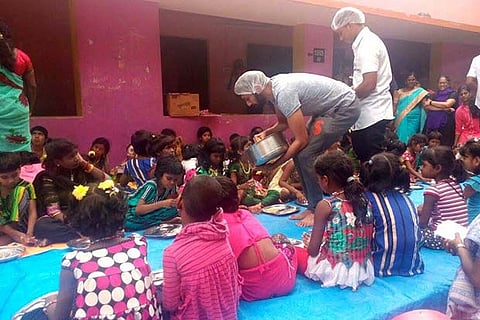 Volunteers serving lunch to the children at Arun Home in Purasawalkam