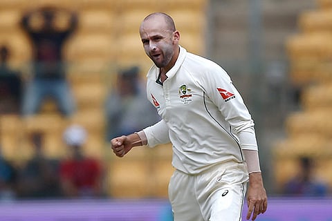 Nathan Lyon celebrates the wicket Virat Kohli