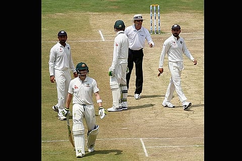 Umpire Nigel Llong sends Steve Smith back to the pavilion