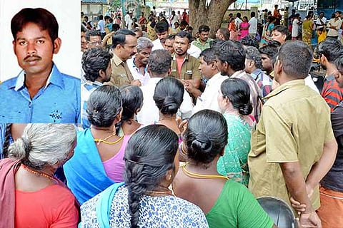 Sanitary workers and relatives of Ramesh?s (inset) family arguing with police