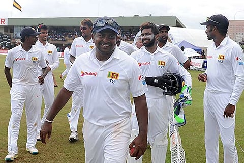 Sri Lanka captain Rangana Herath leads his teammates off the ground after beating Bangladesh