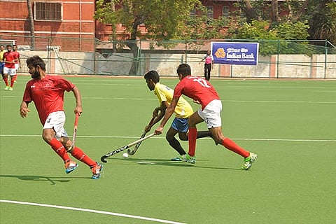 Action during the Indian Bank-IOB state level hockey final match