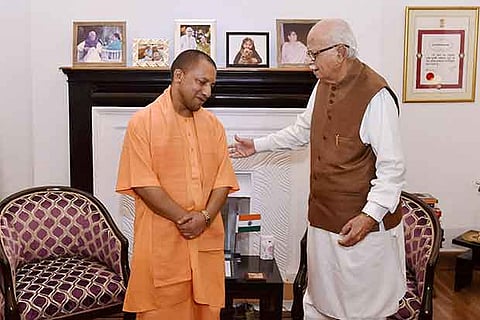 Chief Minister of UP Yogi Adityanath meeting senior BJP leader L K Advani in New Delhi