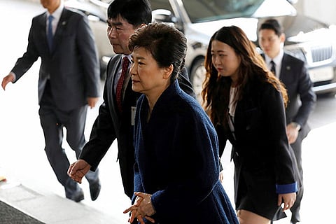 South Korea's ousted leader Park Geun-hye, foreground, arrives at a prosecutor's office