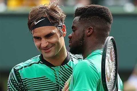 Roger Federer (left) with Frances Tiafoe